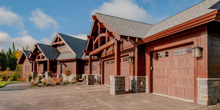 beautiful custom timber framed home with stonework and large garages