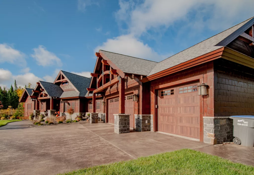 full home picture of the exterior of a rustic custom home with garages